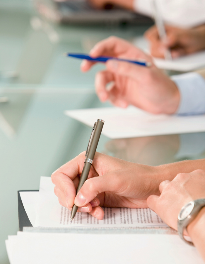 Professionals writing during training